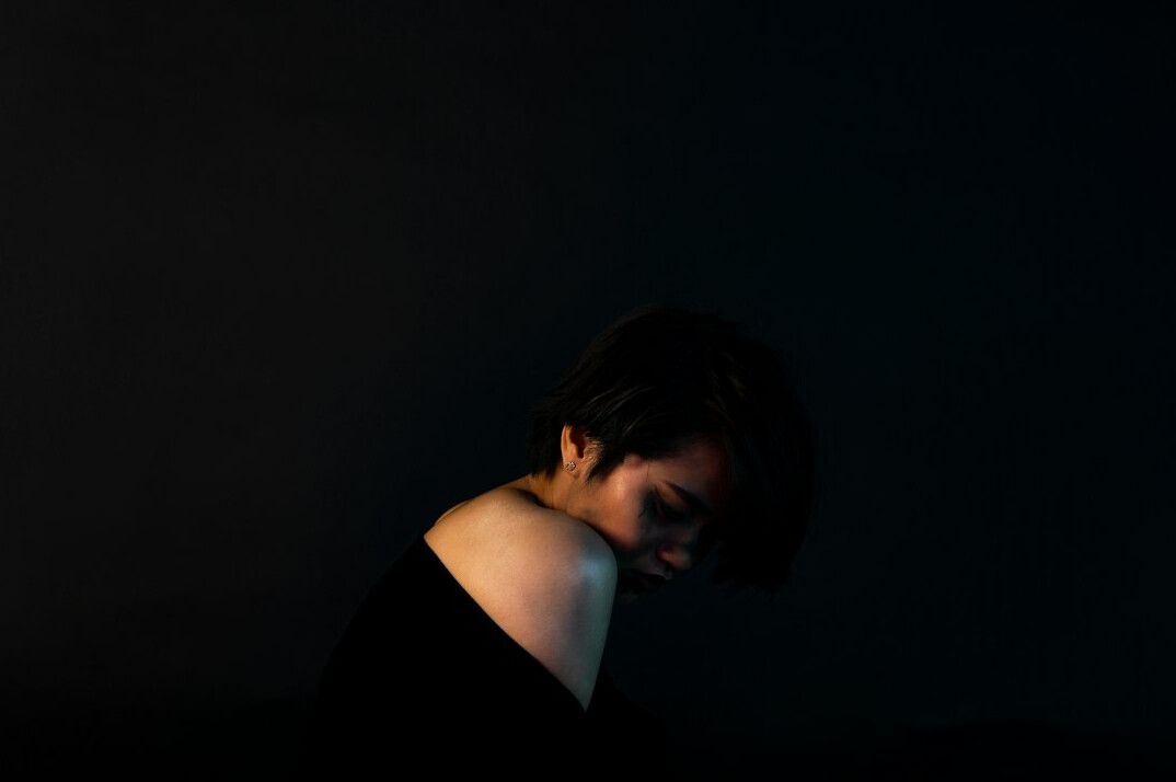 scared woman in dark room